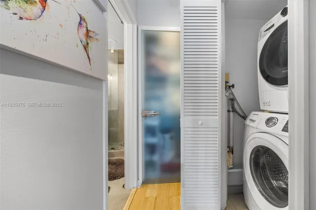 a view of a hallway with washer and dryer