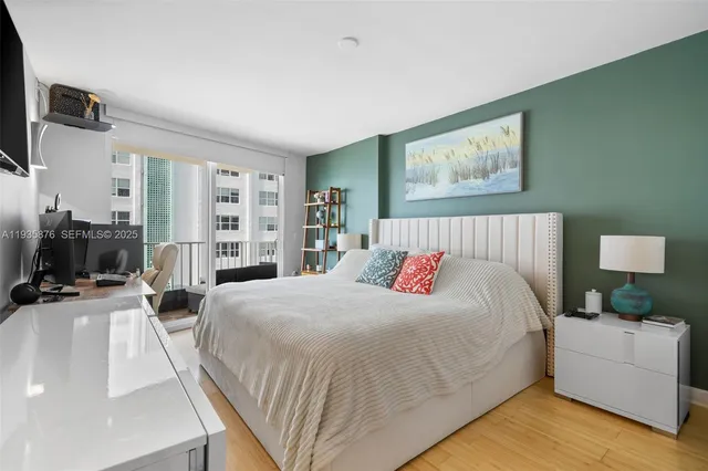 a bedroom with a large bed and a couch