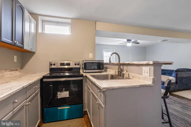 a kitchen with a sink and cabinets