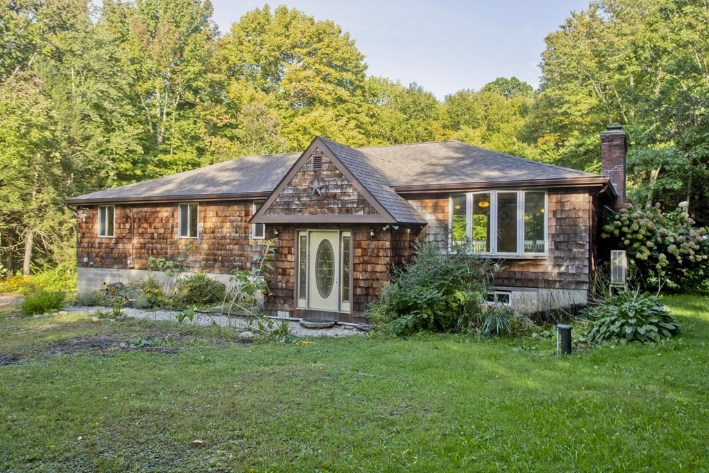 27 Searle Road Huntington, MA 01050 - Photo 1 of 32 a front view of a house with garden