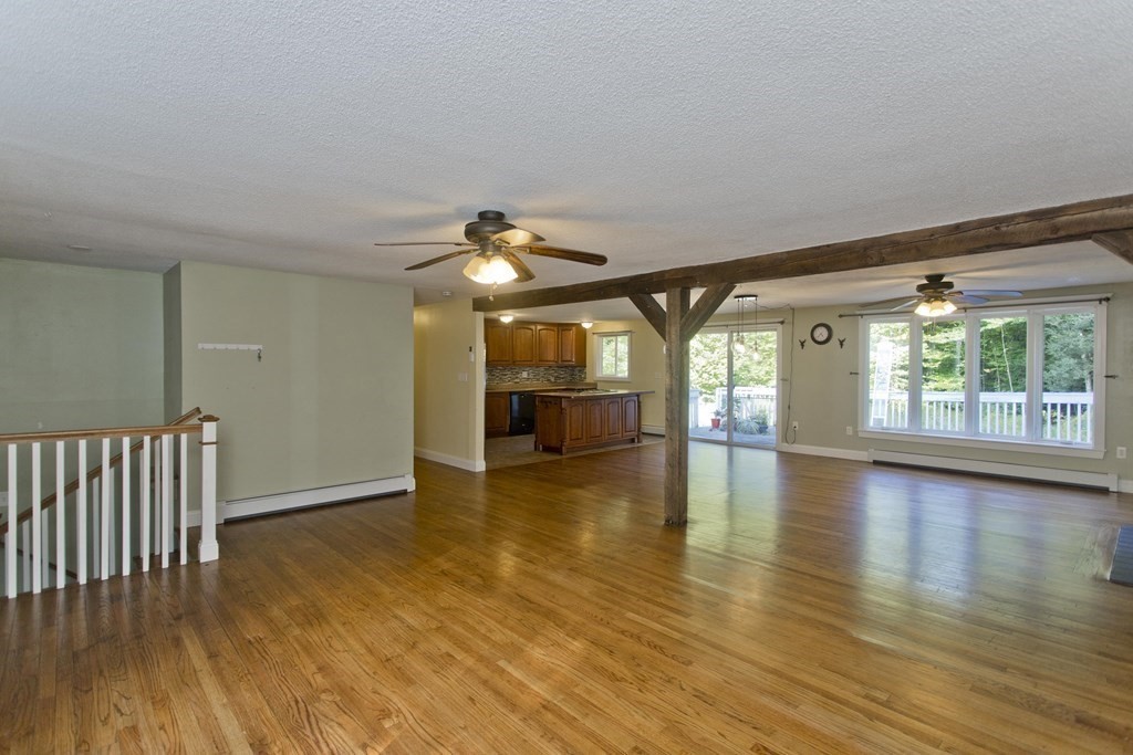 27 Searle Road Huntington, MA 01050 - Photo 11 of 32 an empty room with wooden floor and windows
