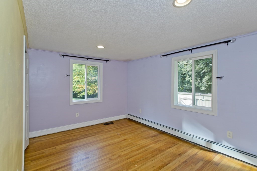 27 Searle Road Huntington, MA 01050 - Photo 18 of 32 a view of an empty room with wooden floor and a window