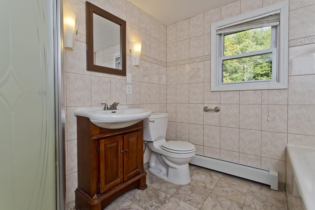 27 Searle Road Huntington, MA 01050 - Photo 22 of 32 a bathroom with a sink a toilet and shower