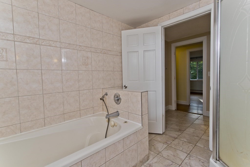 27 Searle Road Huntington, MA 01050 - Photo 23 of 32 a bathroom with a bathtub