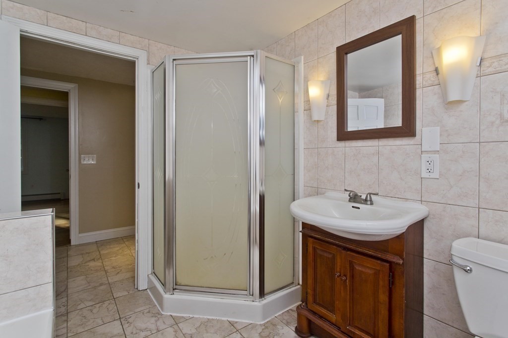 27 Searle Road Huntington, MA 01050 - Photo 24 of 32 a bathroom with a toilet sink and mirror