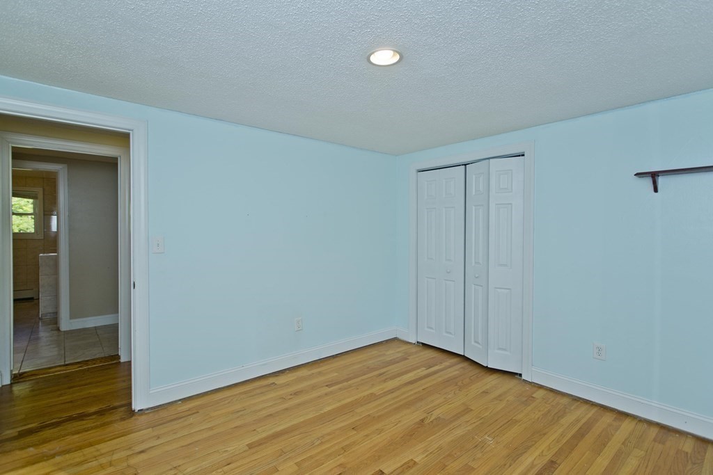 27 Searle Road Huntington, MA 01050 - Photo 27 of 32 a view of empty room with wooden floor
