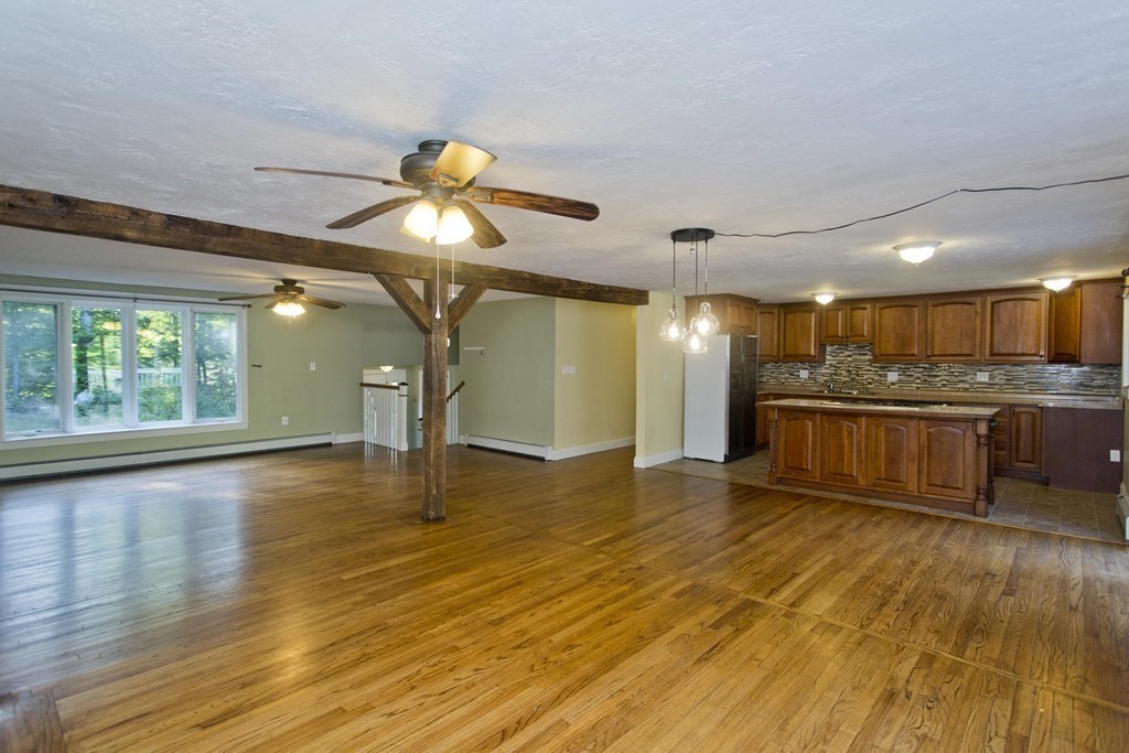 27 Searle Road Huntington, MA 01050 - Photo 3 of 32 a view of a room with wooden floor and chandelier