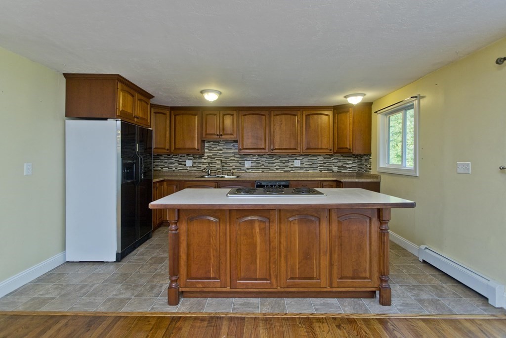 27 Searle Road Huntington, MA 01050 - Photo 6 of 32 a kitchen with stainless steel appliances granite countertop a stove a refrigerator and a sink