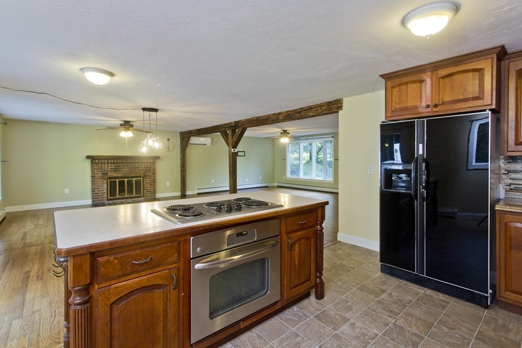 27 Searle Road Huntington, MA 01050 - Photo 7 of 32 a kitchen with a stove and a refrigerator