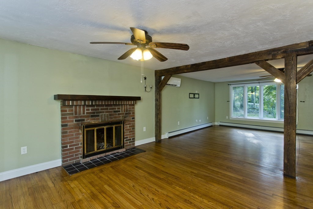27 Searle Road Huntington, MA 01050 - Photo 8 of 32 a view of an empty room with window and wooden floor
