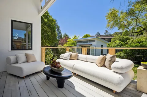 a view of outdoor sitting area with furniture