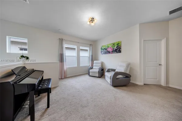 a view of a livingroom with furniture and windows