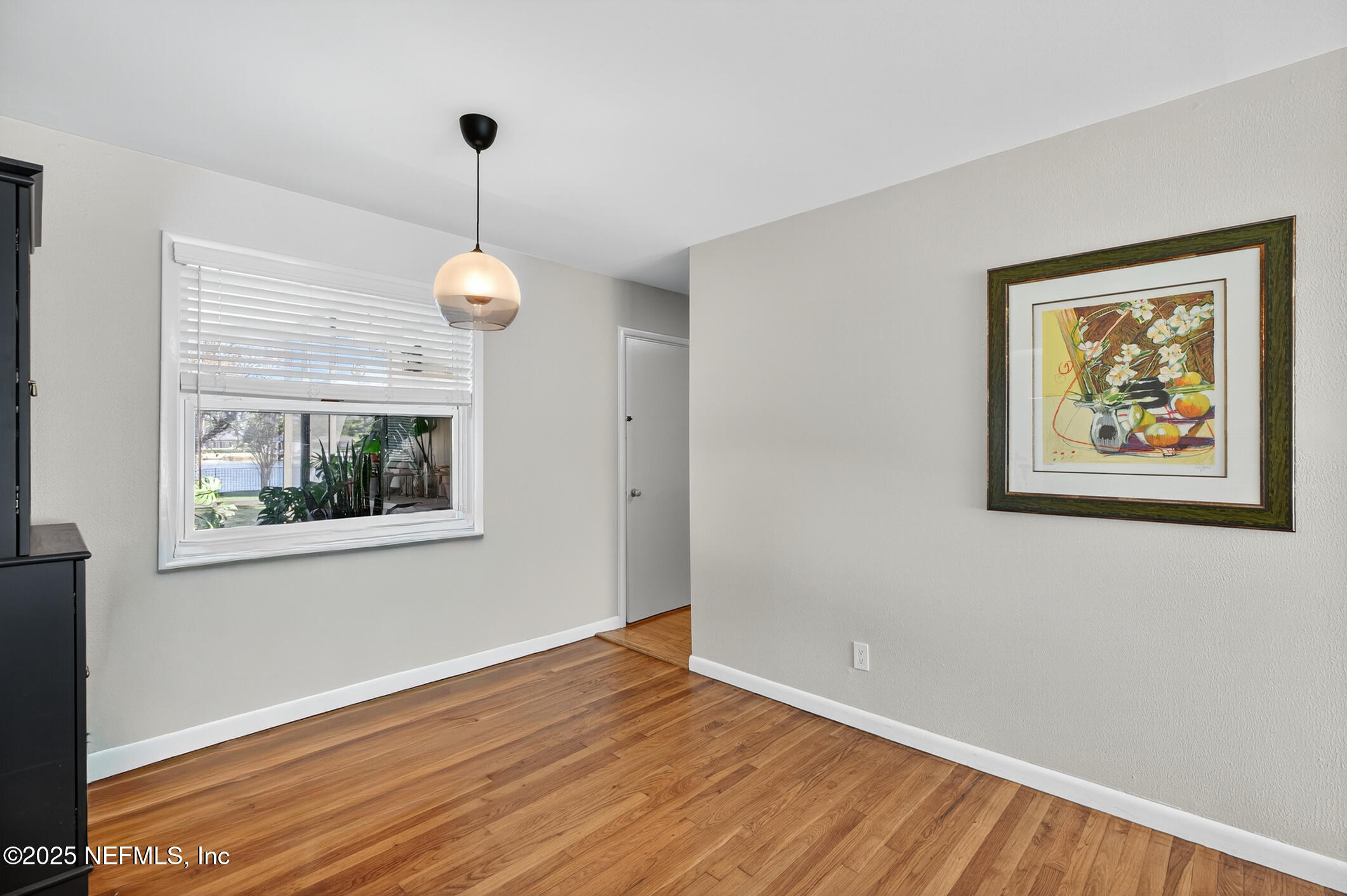 7470 Spinola Road Jacksonville, FL 32217 - Photo 19 of 76 a view of a room with wooden floor and window