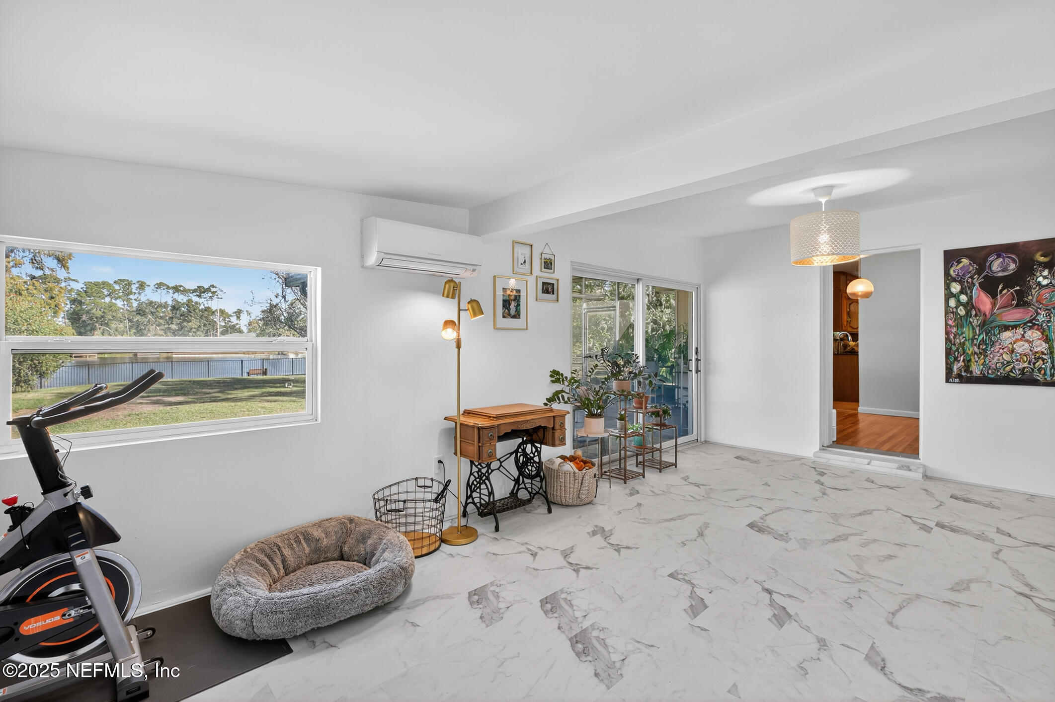 7470 Spinola Road Jacksonville, FL 32217 - Photo 22 of 76 a bedroom with furniture and a window