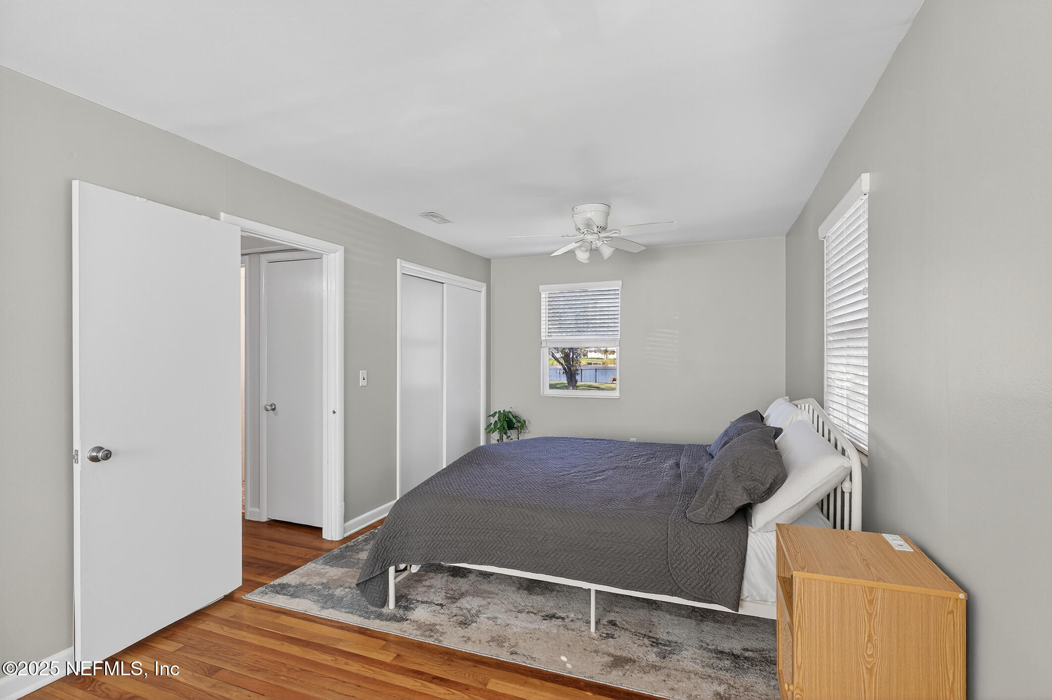 7470 Spinola Road Jacksonville, FL 32217 - Photo 42 of 76 a bedroom with a bed and window