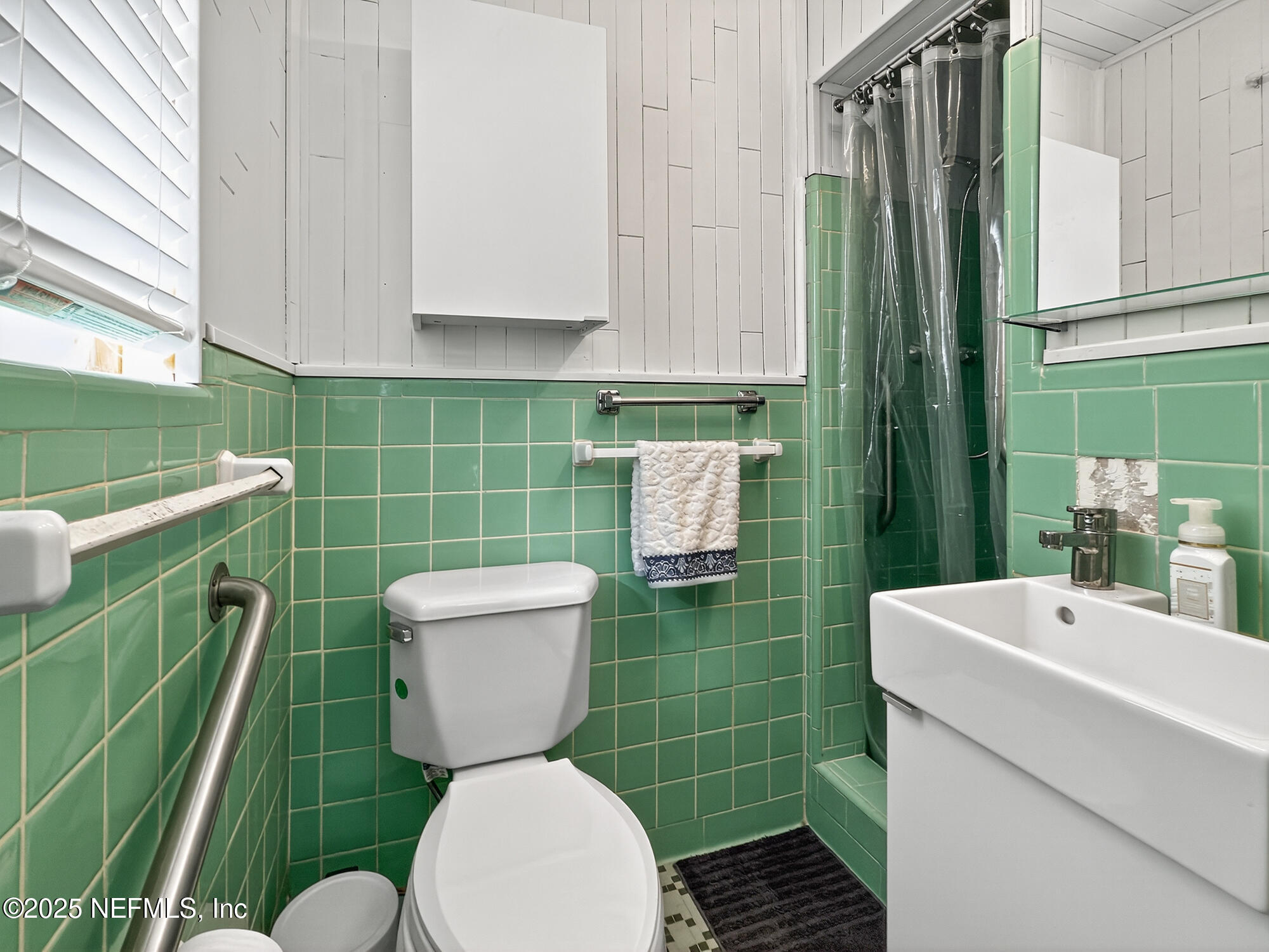 7470 Spinola Road Jacksonville, FL 32217 - Photo 48 of 76 a bathroom with a toilet and a sink