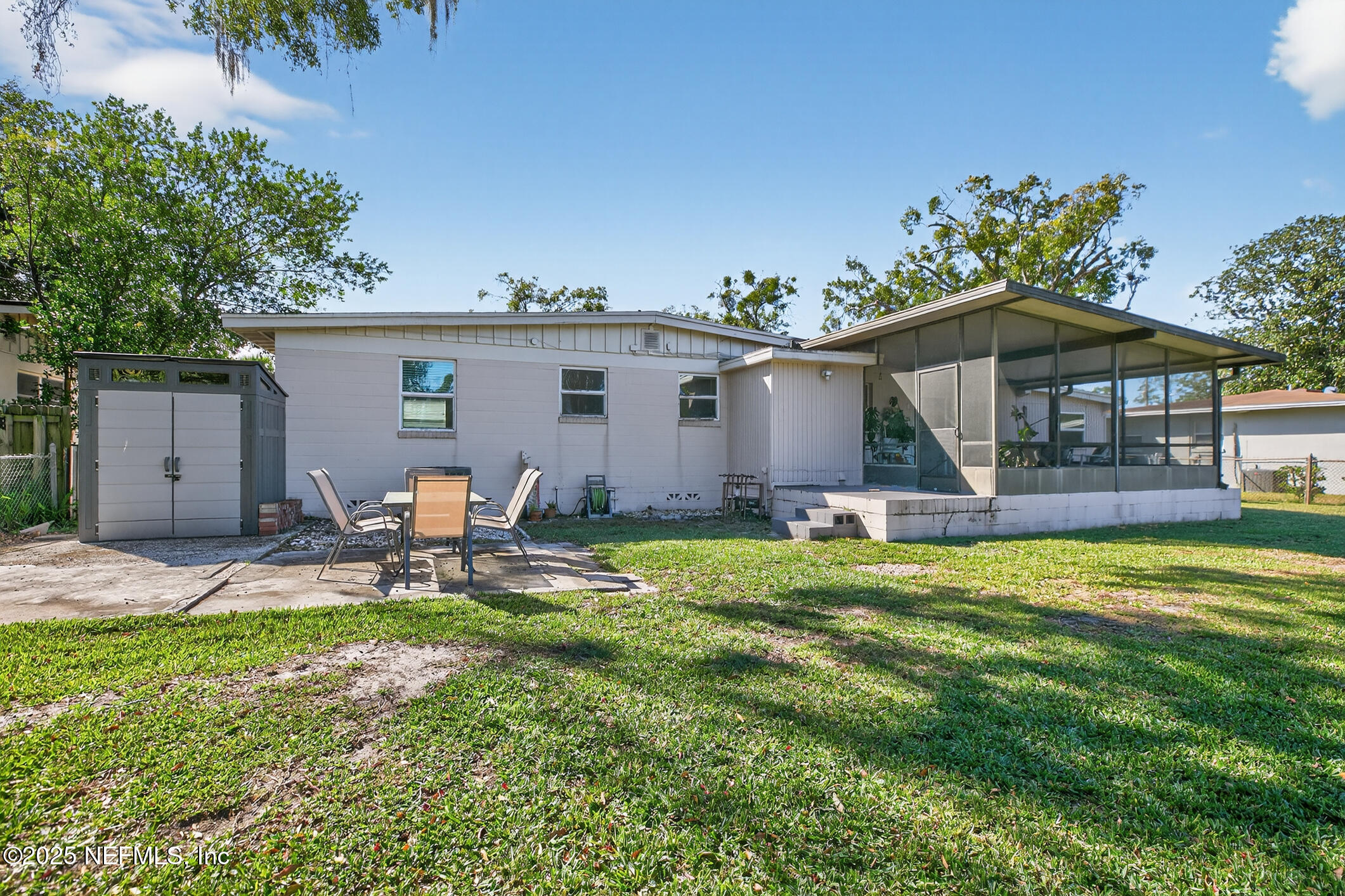 7470 Spinola Road Jacksonville, FL 32217 - Photo 58 of 76 a front view of house with yard and seating area