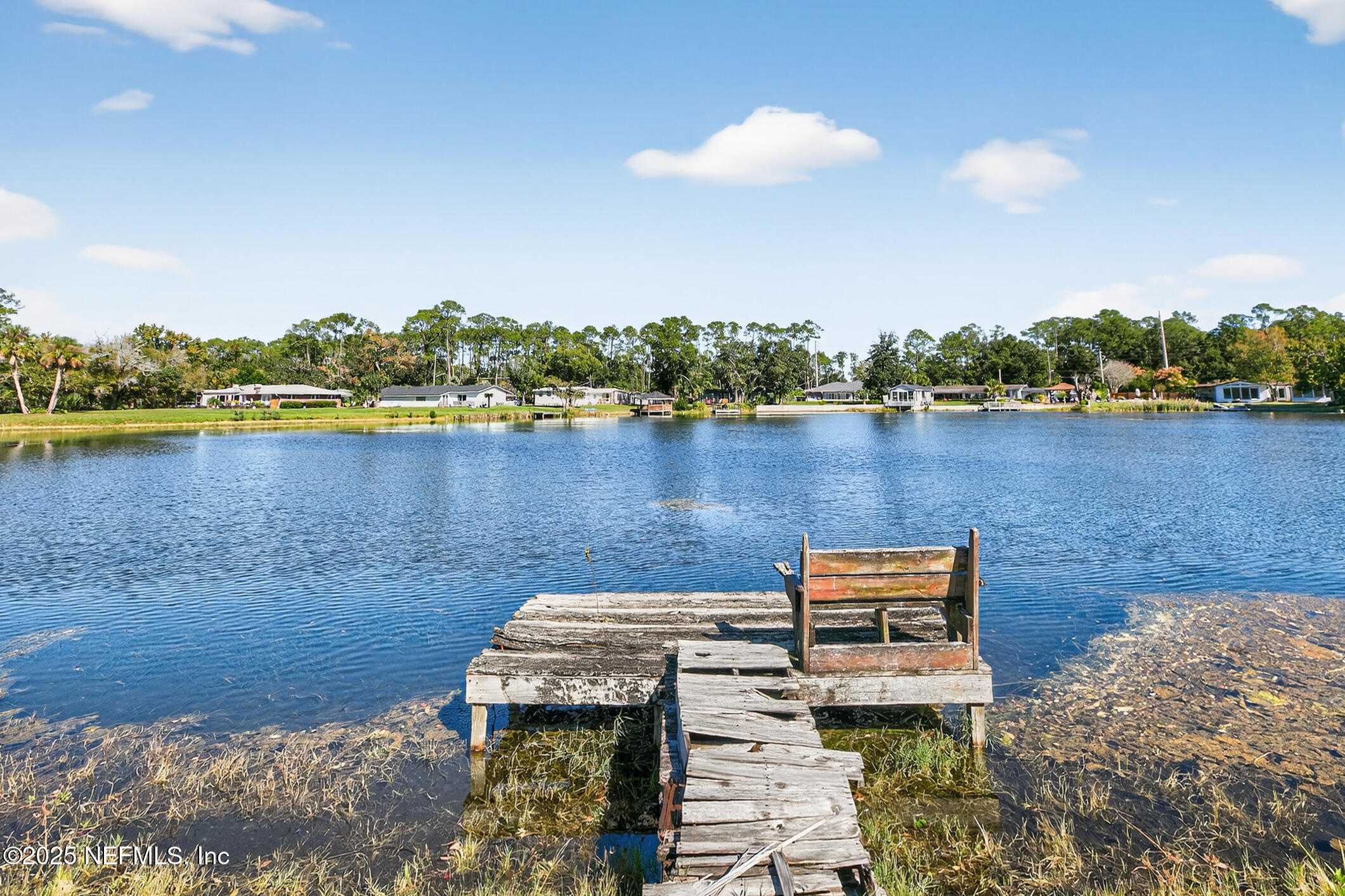 7470 Spinola Road Jacksonville, FL 32217 - Photo 62 of 76 an aerial view of a house with a lake view