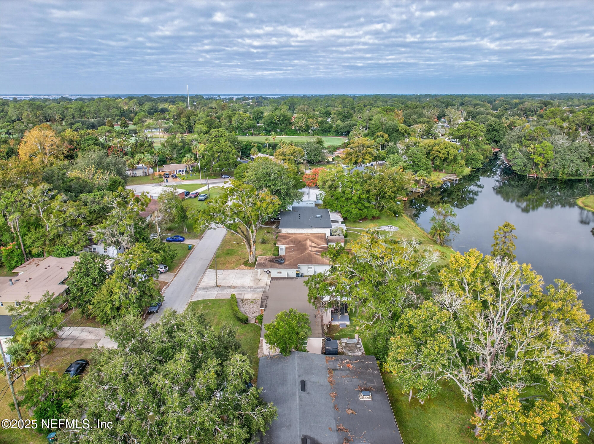 7470 Spinola Road Jacksonville, FL 32217 - Photo 65 of 76 an aerial view of a house with a lake view