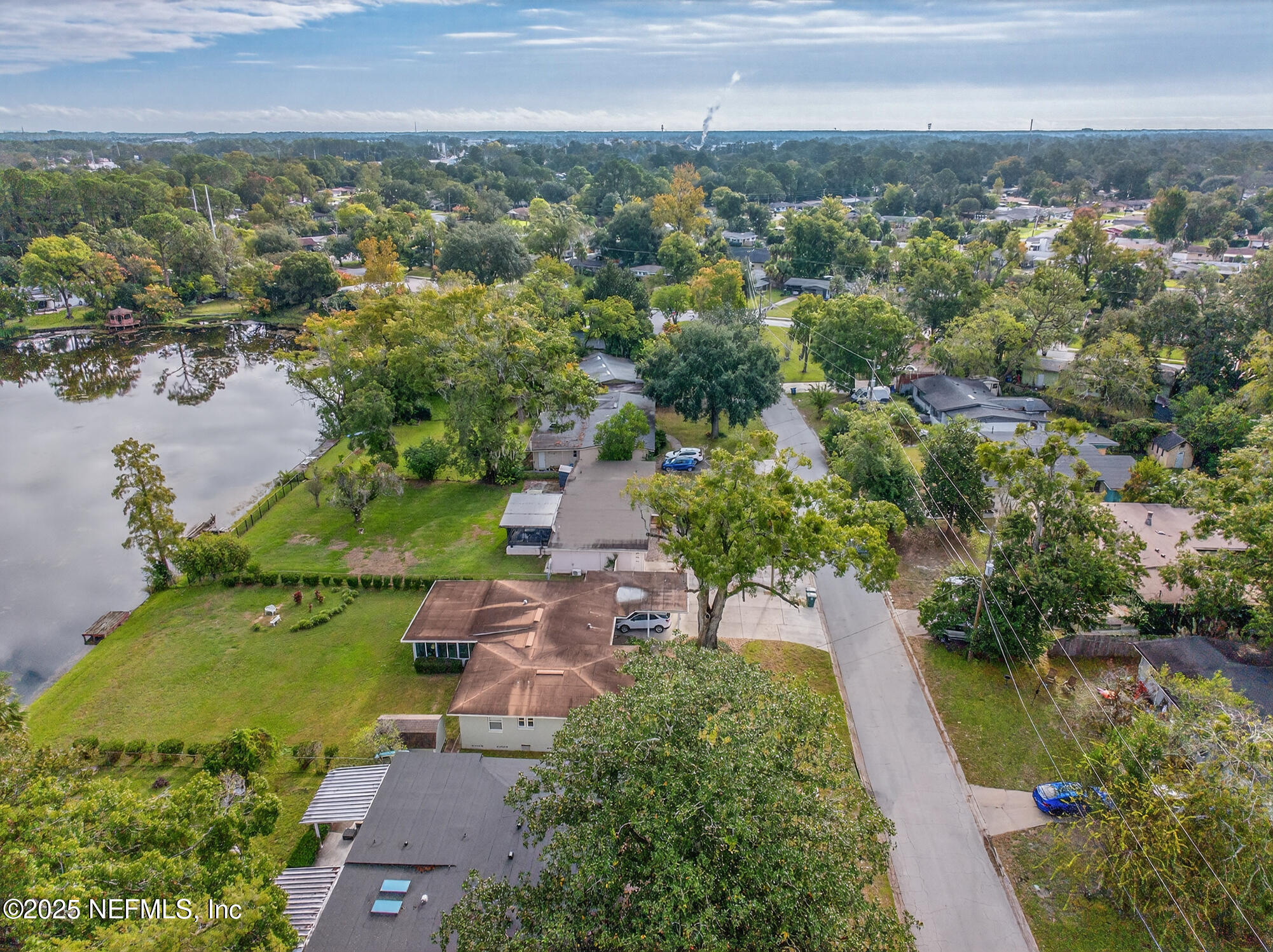 7470 Spinola Road Jacksonville, FL 32217 - Photo 69 of 76 an aerial view of a house with outdoor space and lake view