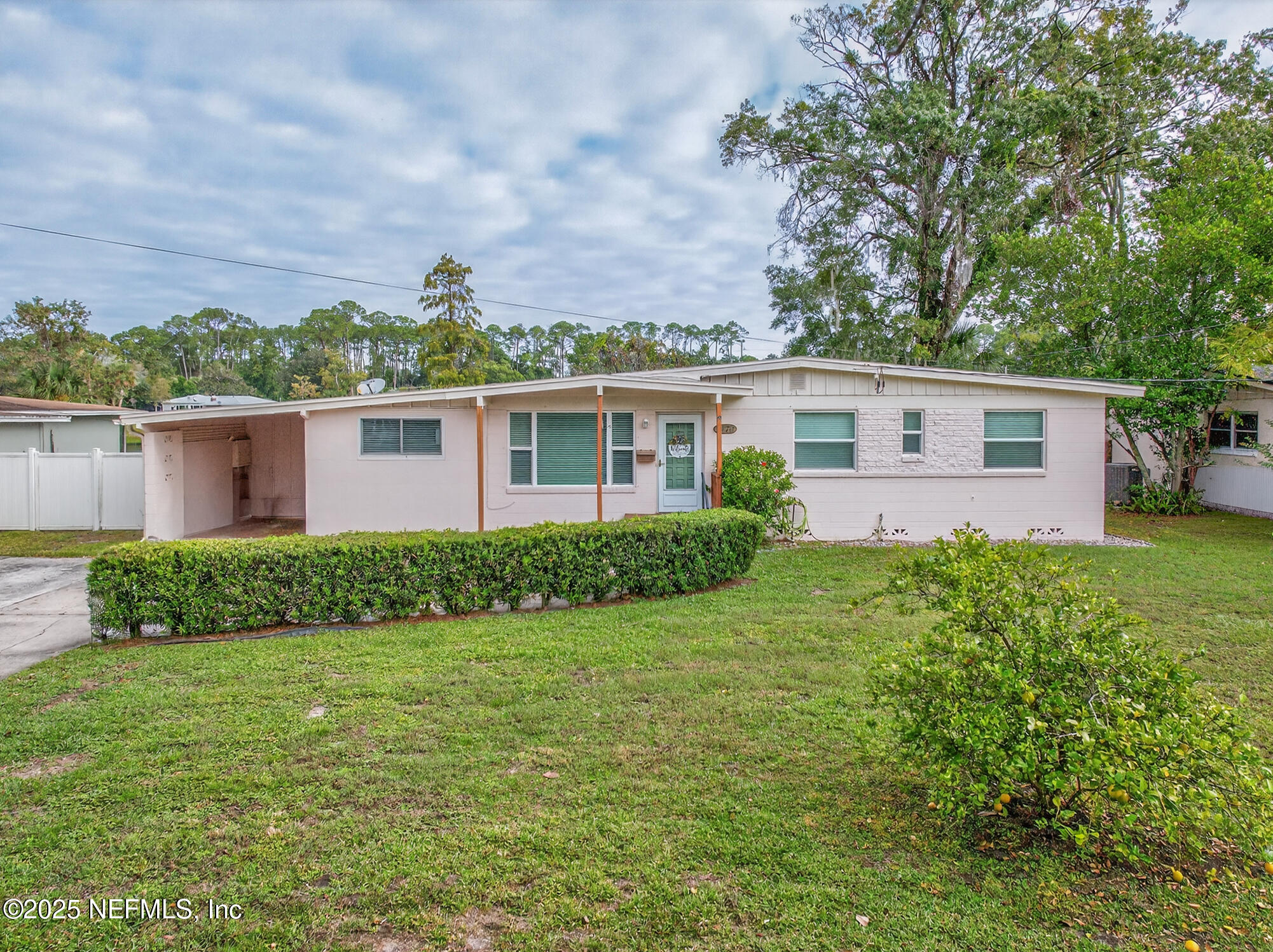 7470 Spinola Road Jacksonville, FL 32217 - Photo 8 of 76 a front view of house with yard and green space