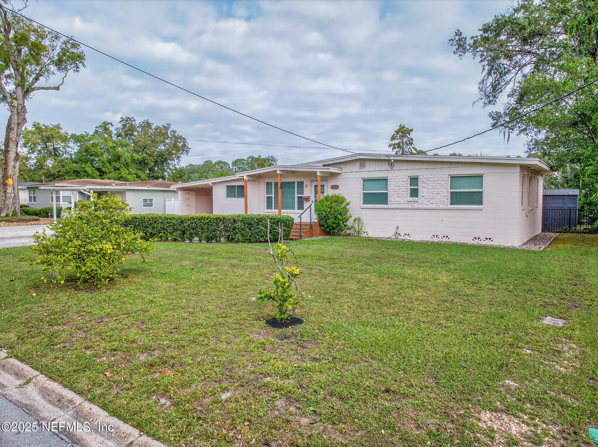 7470 Spinola Road Jacksonville, FL 32217 - Photo 9 of 76 a front view of house with yard and green space