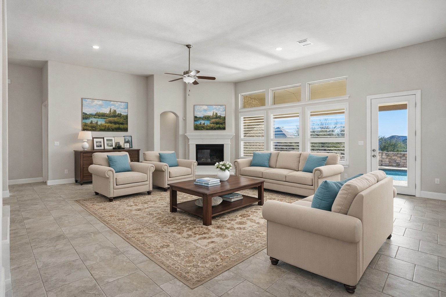 4109 Haight Street Round Rock, TX 78681 - Photo 12 of 40 Living room featuring a glass covered fireplace, ceiling fan, recessed lighting, and arched walkways