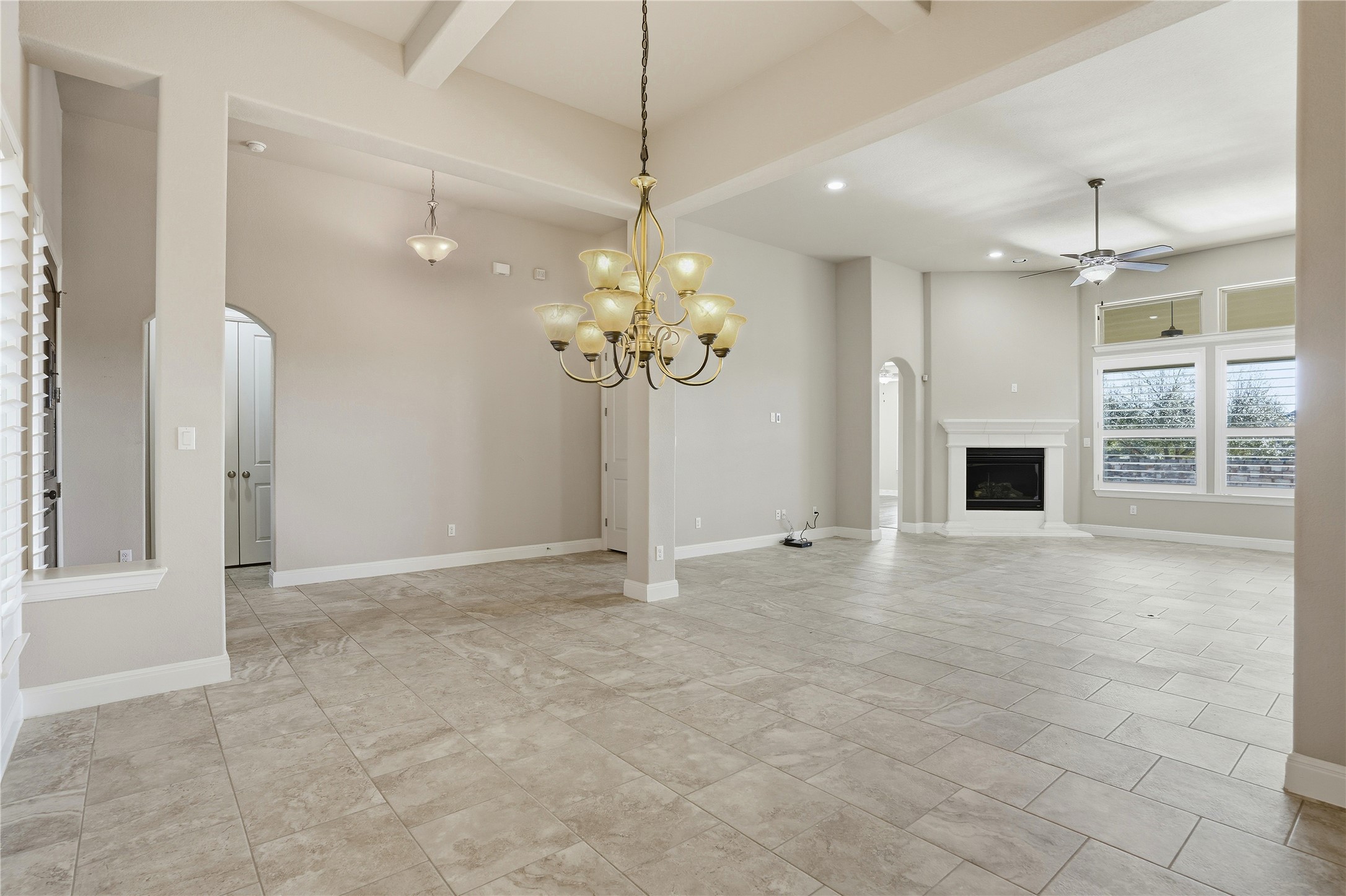 4109 Haight Street Round Rock, TX 78681 - Photo 14 of 40 Large living room with gas fireplace and plantation shutters