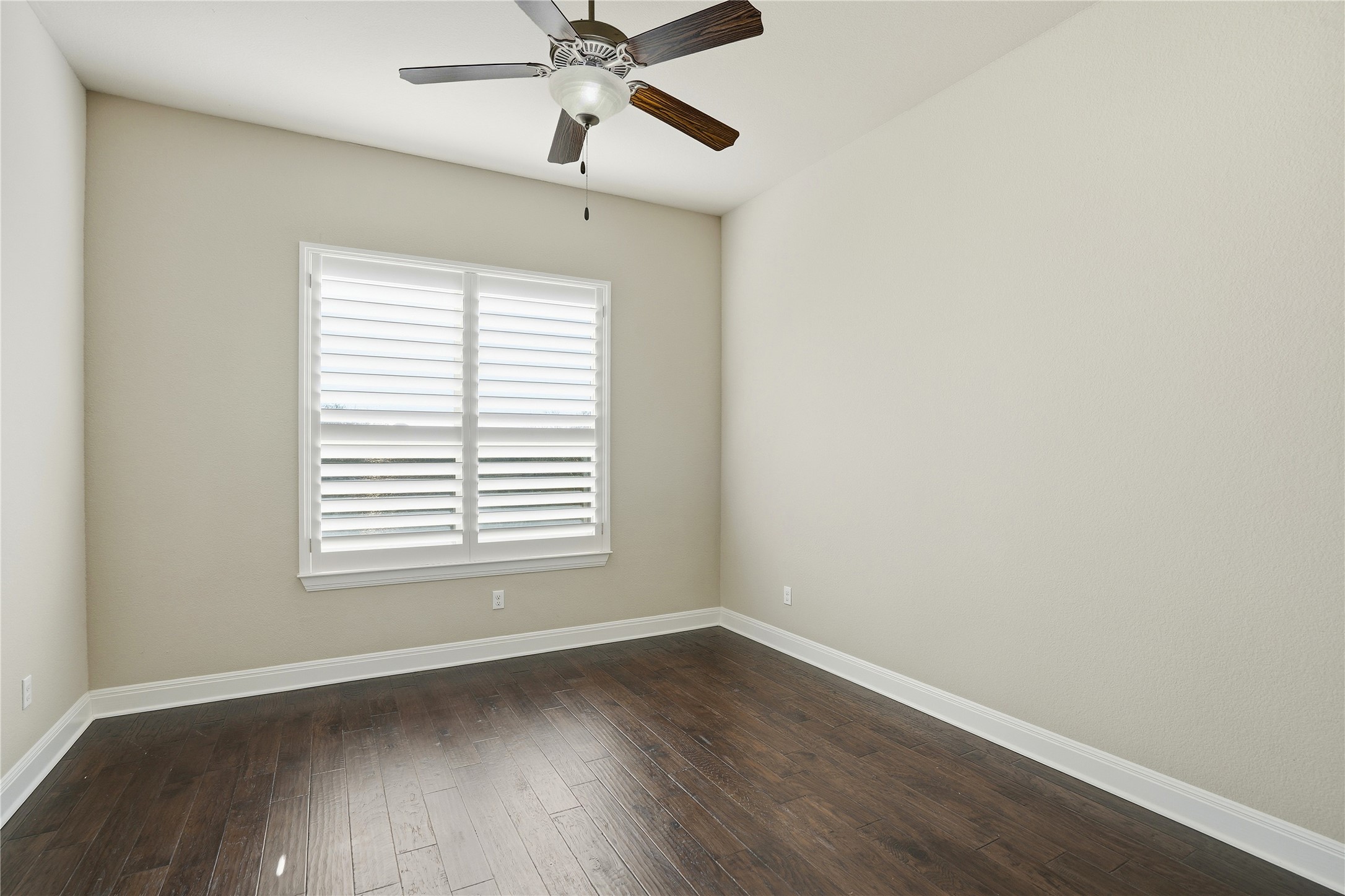 4109 Haight Street Round Rock, TX 78681 - Photo 16 of 40 Home office with a ceiling fan and beautiful wood floors