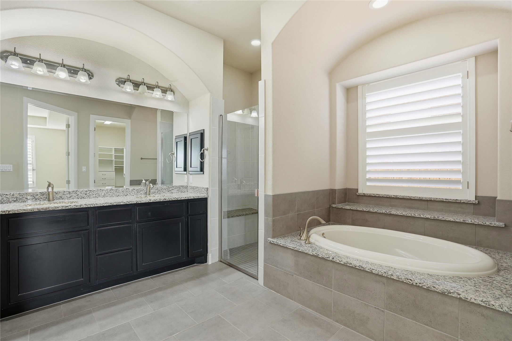 4109 Haight Street Round Rock, TX 78681 - Photo 21 of 40 Full bathroom featuring double vanity and a walk-in closet