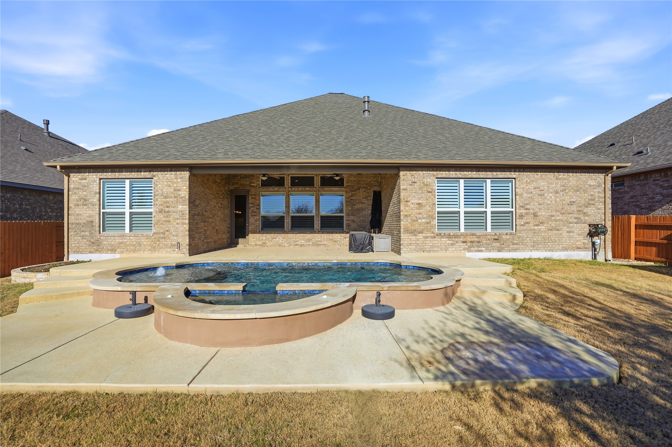 4109 Haight Street Round Rock, TX 78681 - Photo 34 of 40 Rear view of property pool/spa and large covered patio