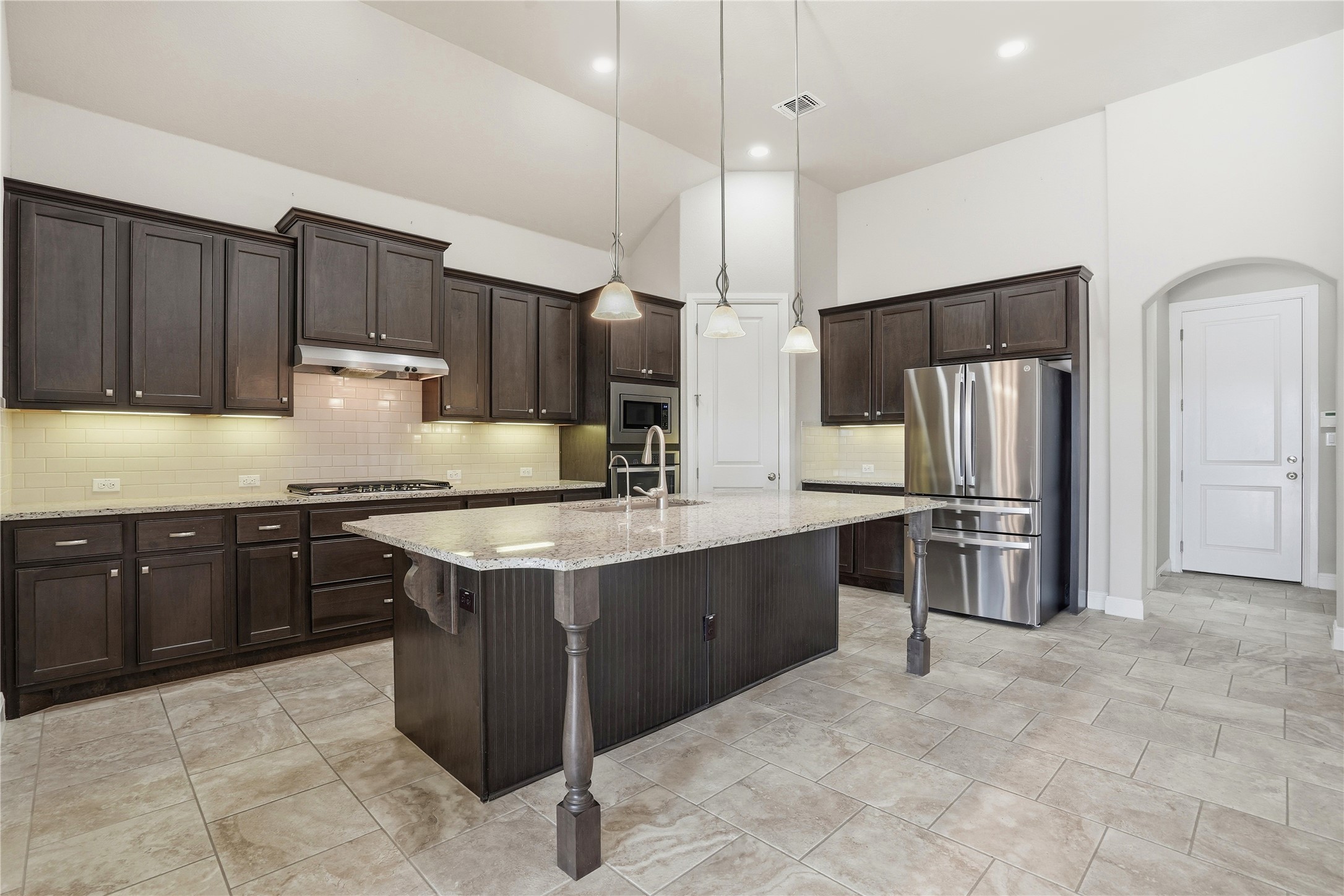 4109 Haight Street Round Rock, TX 78681 - Photo 9 of 40 Beautiful kitchen offers a large center island, lots of cabinets and plenty of counter space