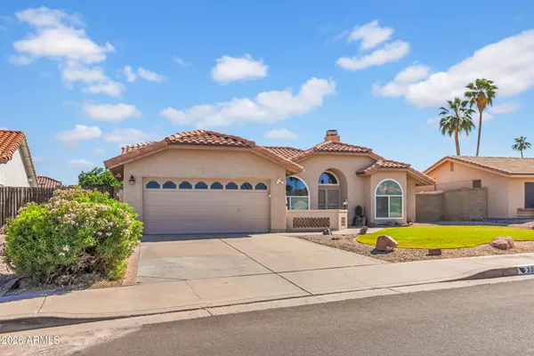 a front view of house with yard and entertaining space
