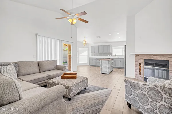 a living room with furniture and a fireplace