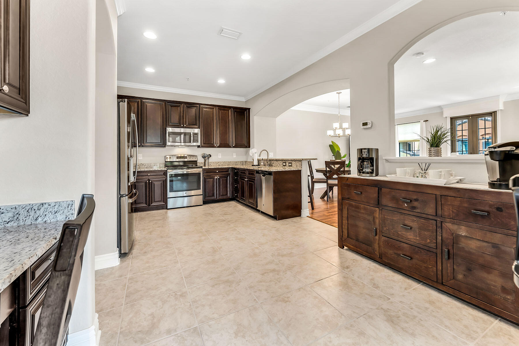 9066 Albion Lane North, Unit 5101 Naples, FL 34113 - Photo 10 of 48 a large kitchen with lots of counter space
