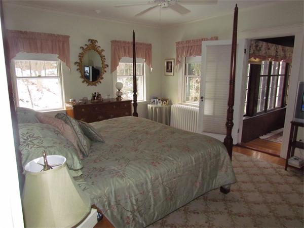 22 Hillside Road Wellesley, MA 02481 - Photo 6 of 9 a bedroom with a bed and wooden floor