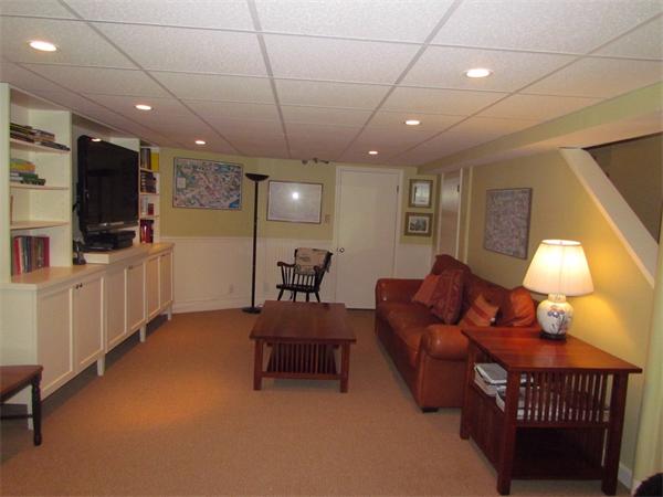22 Hillside Road Wellesley, MA 02481 - Photo 8 of 9 a living room with furniture and a flat screen tv