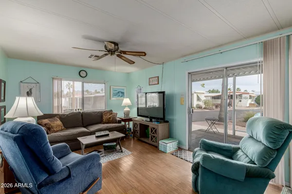 a living room with furniture and a large window