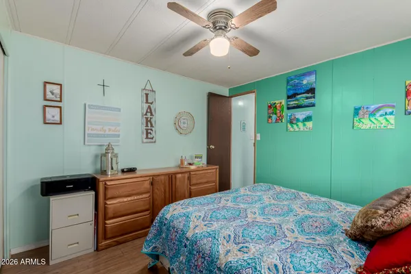 a bedroom with a bed and a table