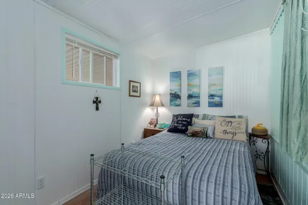 a bedroom with a bed and window