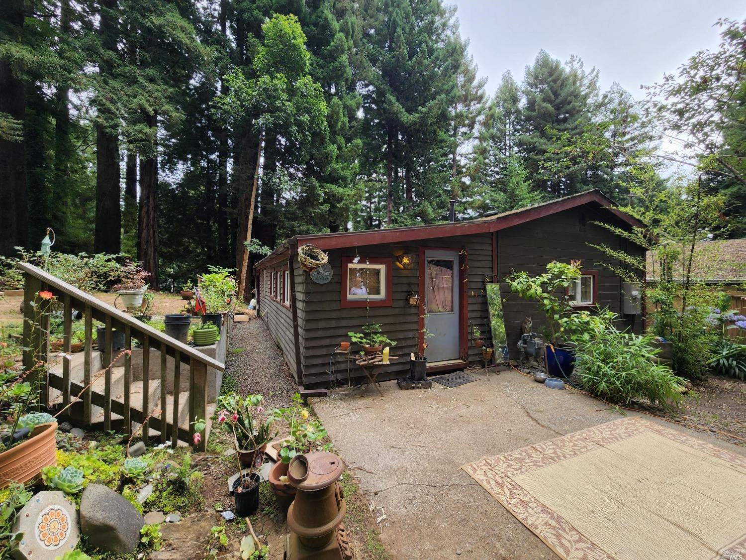 a view of a house with a yard and a garden