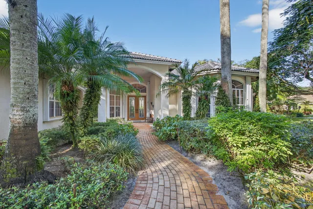 a living room with furniture a chandelier and a chandelier
