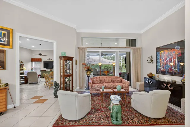 a kitchen with white cabinets and appliances
