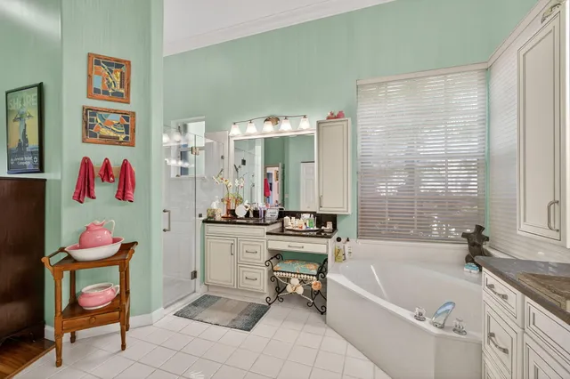 an aerial view of a houses with a yard