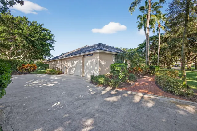 a living room with fireplace furniture and a large window