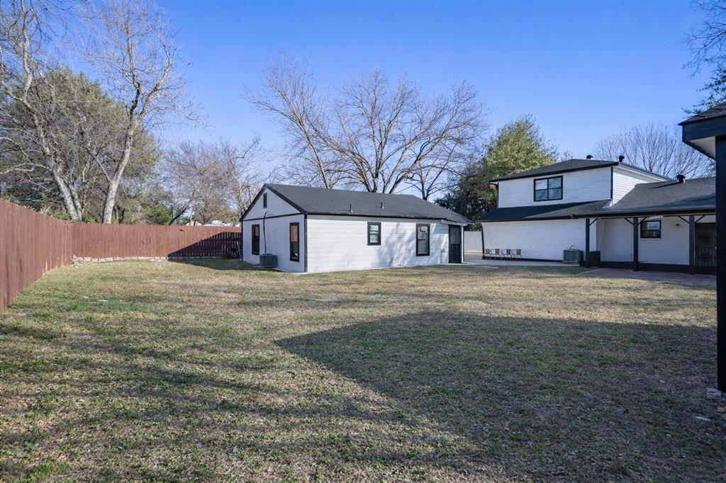 2133 Pleasant Drive Dallas, TX 75227 - Photo 36 of 40 Rear view of property featuring a fenced backyard