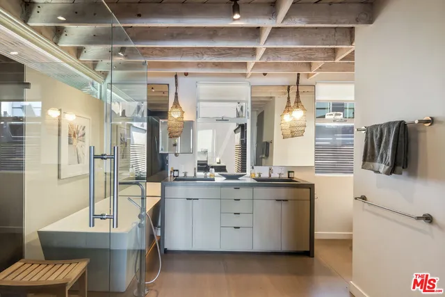 a kitchen with a sink and refrigerator
