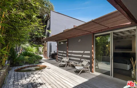 a view of backyard with sitting area