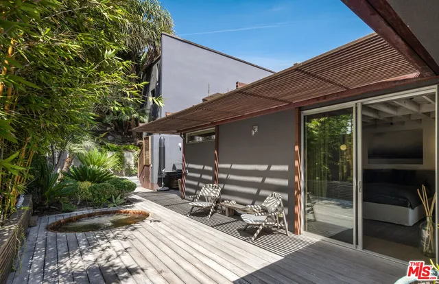 a view of backyard with sitting area