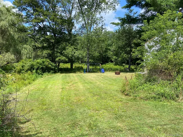 a view of a garden with a bench